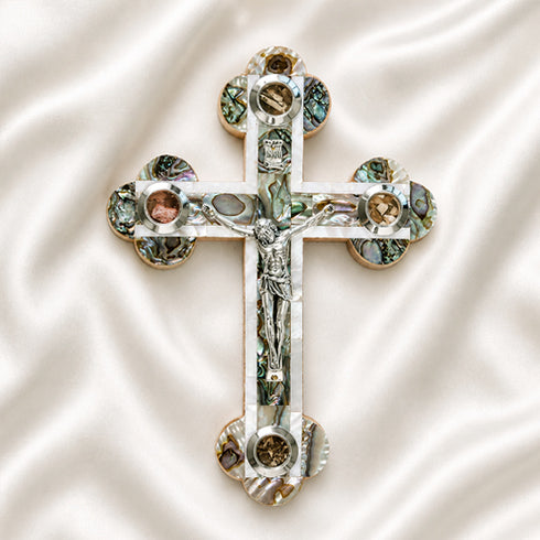 Budded olive wood cross with corpus, mother of pearl, Four Holy Land Elements on a white backdrop.