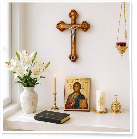 Religious-themed decor with crucifix, icon, candles, and flowers on a shelf.
