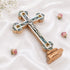 Large budded standing cross with crucifix, mother of pearl inlay and Four Elements laid on white background.