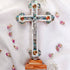 Large budded table cross with crucifix, mother of pearl inlay and Four Elements laid on white background.