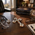 Doctor's desk with stethoscope, cross, books, and eyeglasses.