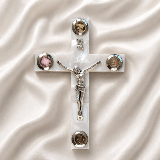 Olive wood Latin cross with crucifix, white Mother of Pearl inlay and Four Elements capsules, on a clean white surface.