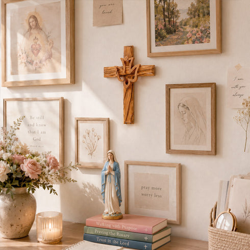 Wall with religious decor including a cross, framed pictures, and a statue of a woman.