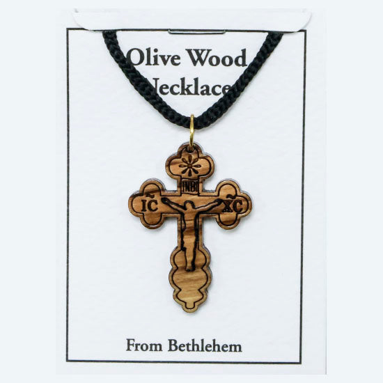 Olive wood crucifix necklace on a card with text 'Olive Wood Necklace' and 'From Bethlehem'.