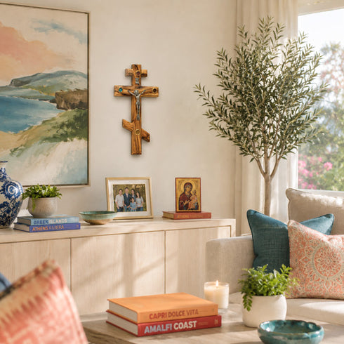 Living room with a cross, family photos, and decorative items on a cabinet.