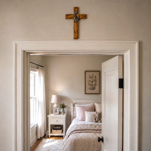 Bedroom with a wooden cross on the wall above the bed