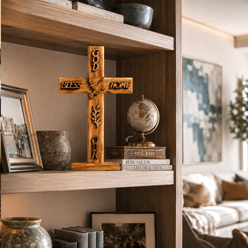 Wooden cross with engraved text on a shelf in a living room setting