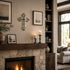 Living room with stone fireplace, candles, and framed pictures.