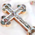 Elegant budded cross handmade from olive wood, featuring a silver-toned crucifix, mother of pearl inlay, and Four Holy Land Elements, styled with soft rose petals on a white backdrop.