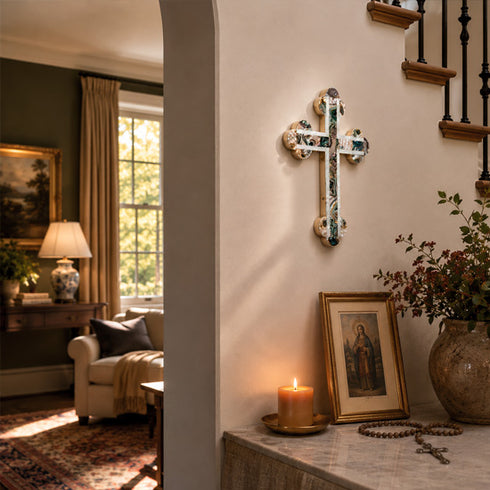 Cross hanging bellow the steps next to a living room
