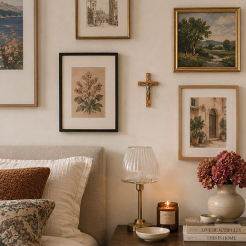 Living room with framed artwork, a lamp, and decorative items on a table.