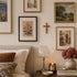 Living room with framed artwork, a lamp, and decorative items on a table.