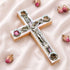 A handcrafted wooden Latin cross with a crucifix, mother of pearl, holy soil, olive leaves, dried flowers, and incense.