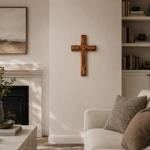 Living room with a fireplace, cross on the wall, and a couch with pillows.