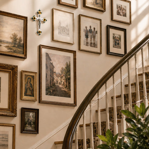 Staircase with framed artwork on the wall