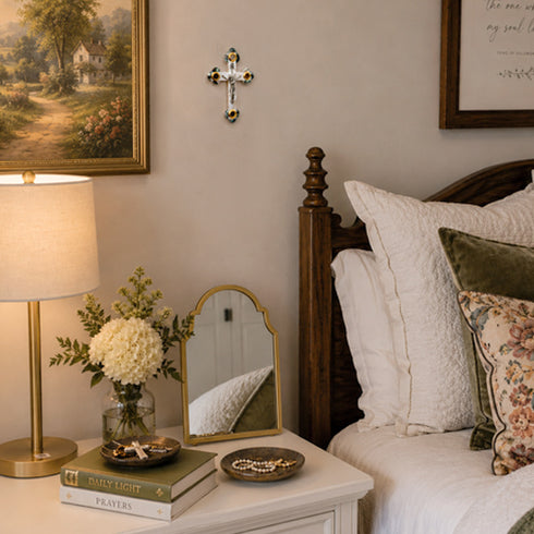 Bedroom with wooden crib, lamp, and decorative items on a shelf.