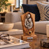 Holy Family olive wood plaque standing on a table in a warm home interior with soft natural light