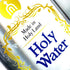 Detail of A clear plastic bottle containing Holy Water from the Holy Land, with a label featuring gold, blue and black text, and a graphic symbol.