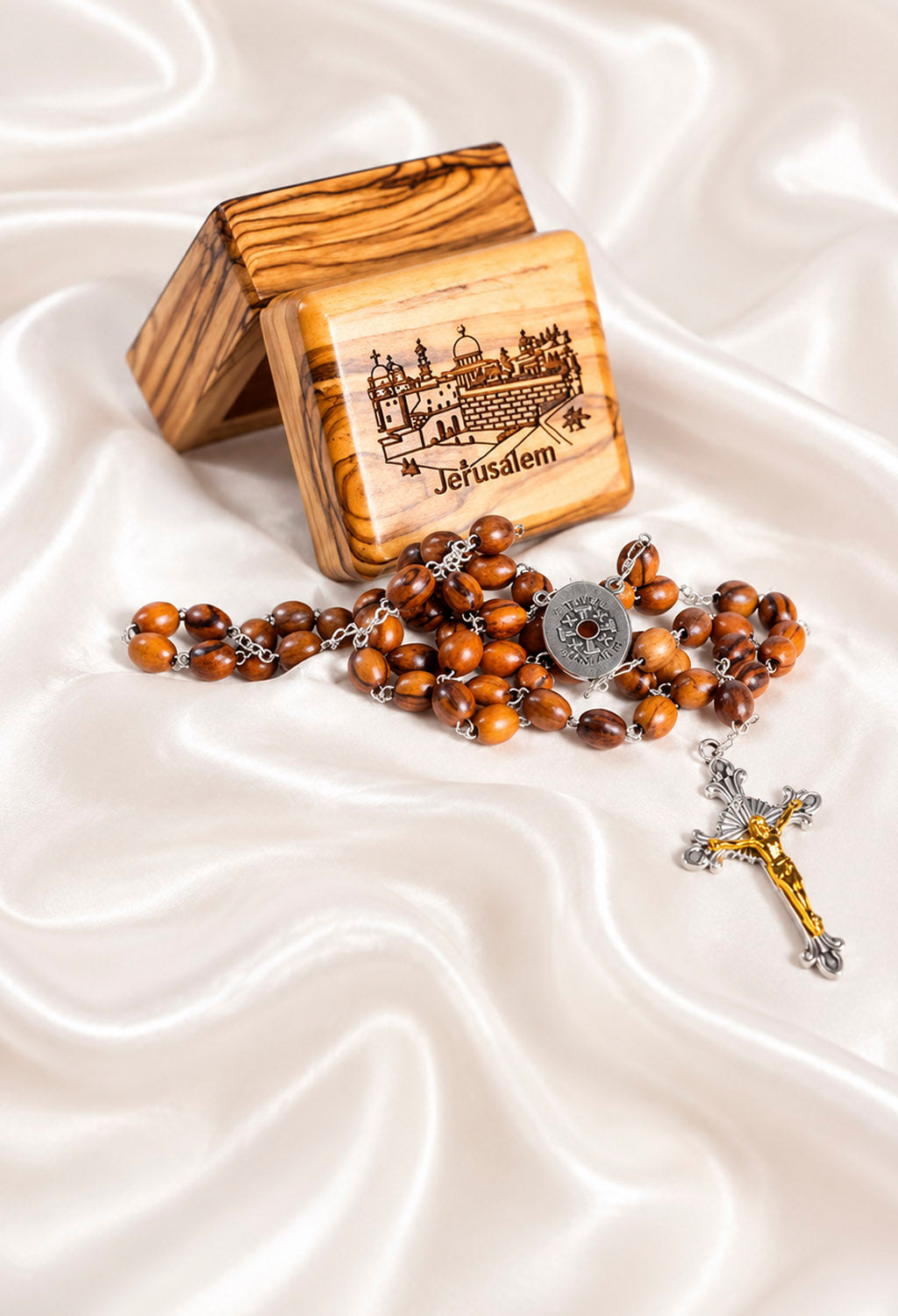 Wooden box with Jerusalem engraved on it and sn olive wood rosary next to it