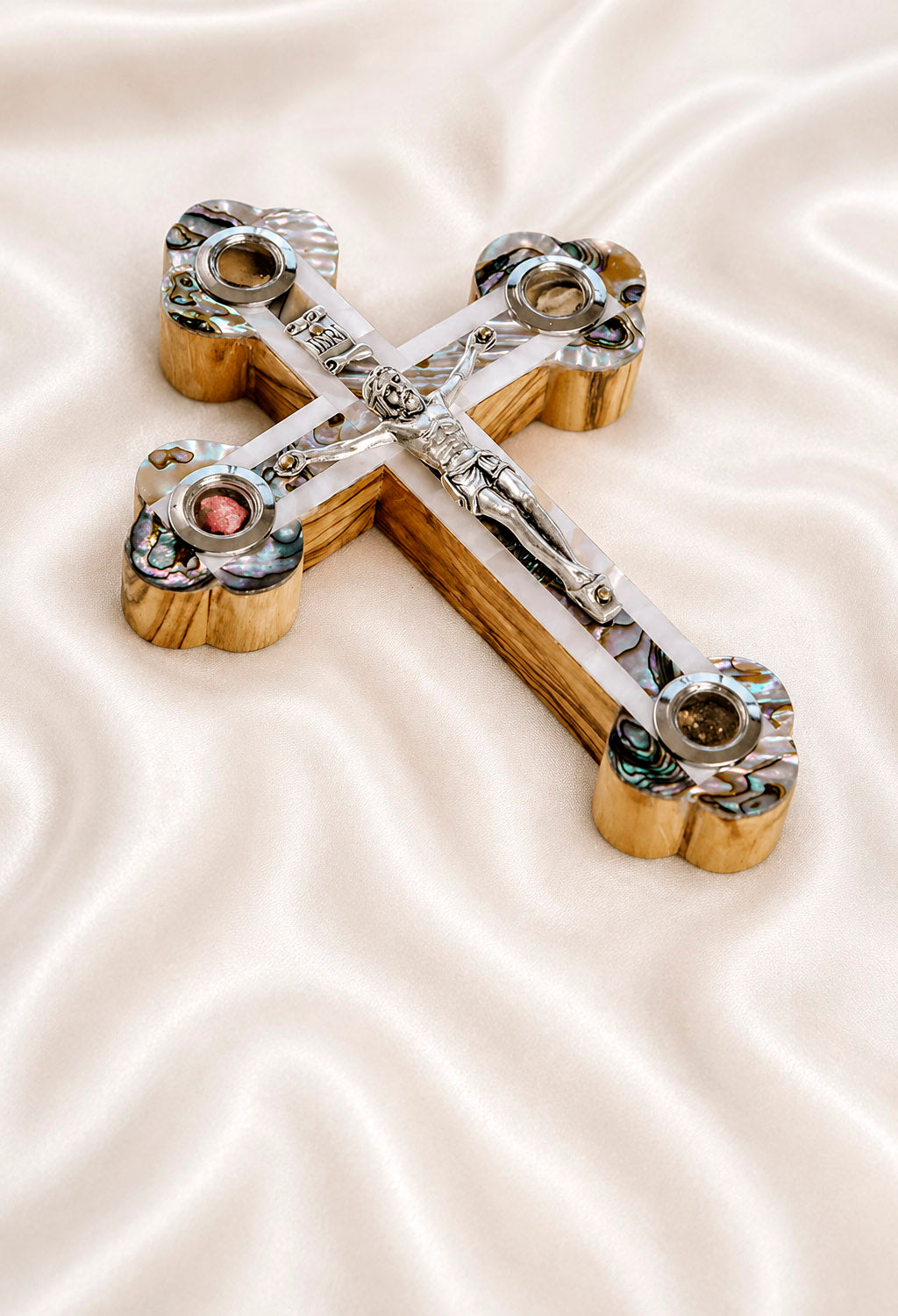 Decorated budded crucifix on a white cloth
