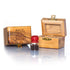 Two small Piece of Holy Land handcrafted olive wood boxes against white background, accompanied by a glass vial with red cap next to it, containing holy soil from the Holy Land.