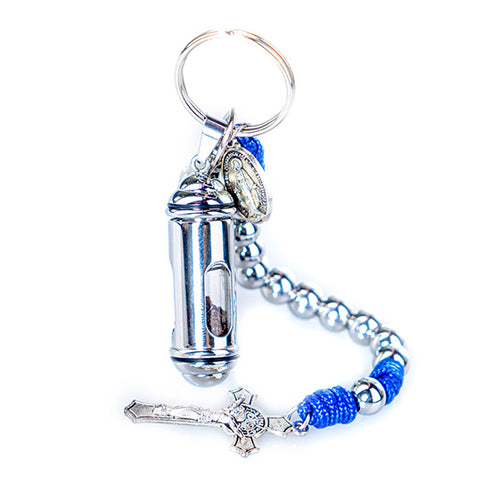 Image of a small blue and iron St. Benedict keychain rosary with a vial of Holy Soil from the Holy Land, against white background.
