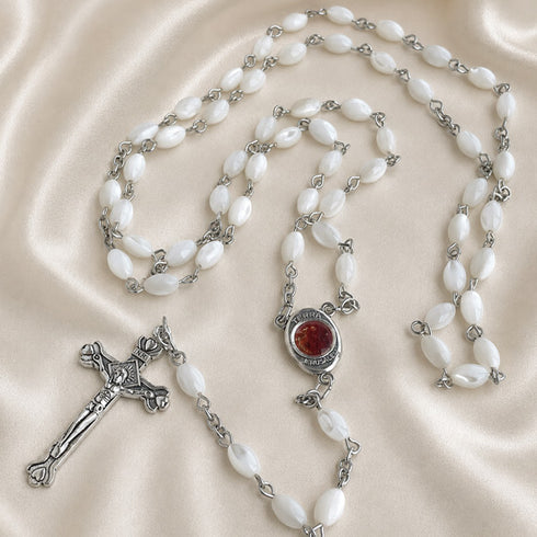 White pearl rosary set with bead strands, round centerpiece, and metal crucifix