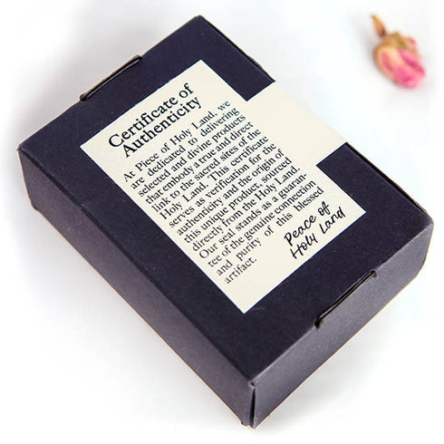 Certificate of Authenticity from Piece of Holy Land on the back of a black box.