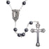 Black hematite rosary with a cross and Lourdes Holy Water medal on a white background.