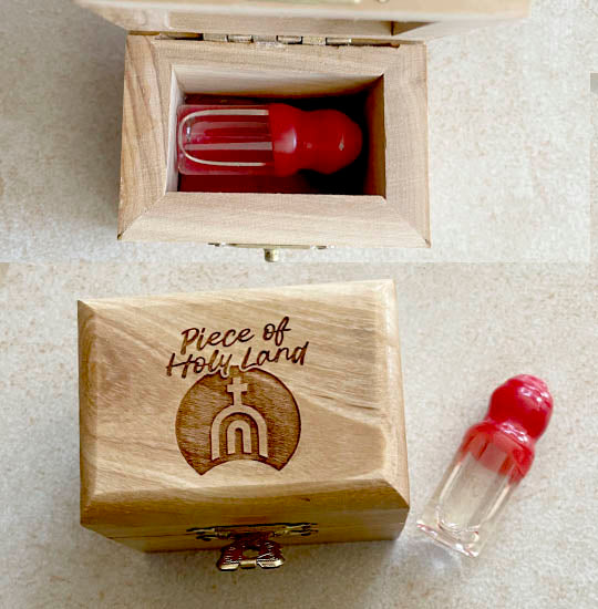 Piece of Holy Land olive wood box with a vial of Holy Water in it.