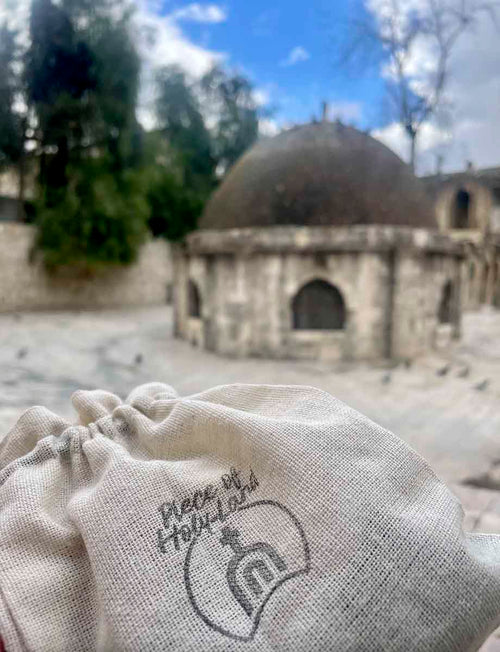 Rooftop and the Deir El-Sultan at the Church of Holy Sepulchre, a cotton bag with Piece of Holy Land logo.