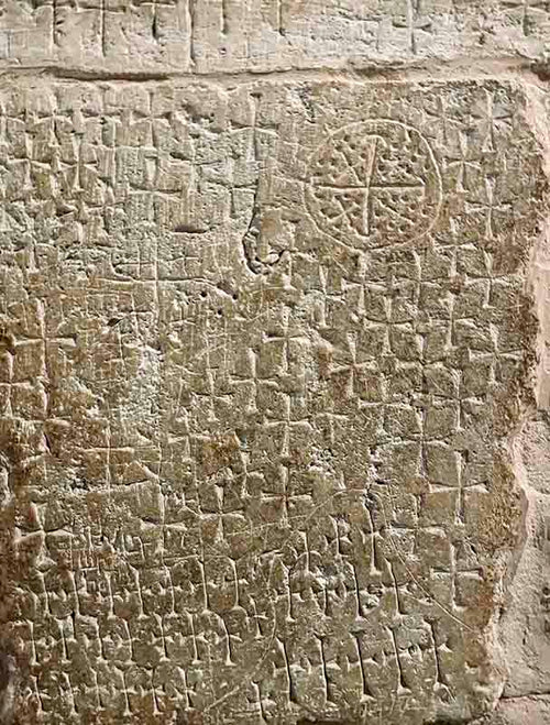 Crusader carvings in shape of cross on a wall in the Church of Holy Sepulchre.