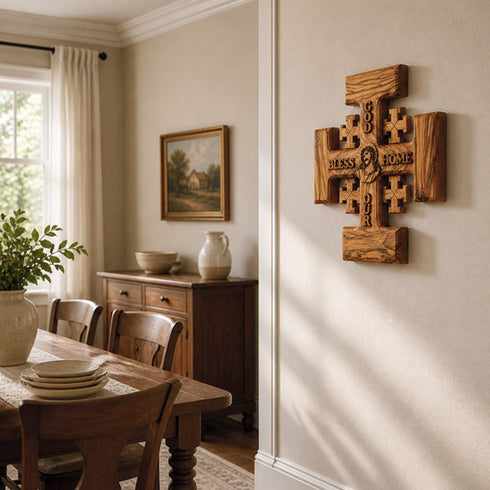 Dining room with wooden cross wall art, table, and chairs.
