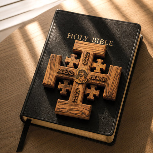 Wooden Jerusalem cross laid on a black bible