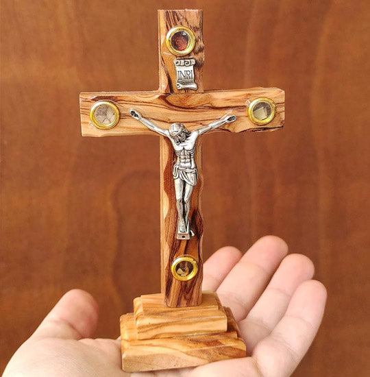 A small standing Olive Wood Crucifix with Four Holy Elements hand-held.