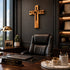 Professional office with a leather chair, desk, and wooden cross on the wall.