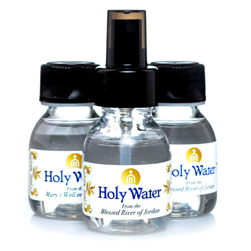 Three small vials of Holy Water from the Jordan River, including one with a sprinkler, displayed on a white background.
