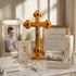 First Holy Communion items including a wooden cross, photo of a boy, and certificate on a marble surface.