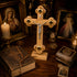 Wooden cross with Jesus Christ figure on a table with books, candles, and religious images.