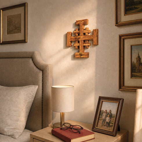 Jerusalem cross on a wall in a bedroom setting
