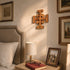 Jerusalem cross on a wall in a bedroom setting