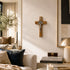 Living room with a crucifix on the wall, books, and decorative items.
