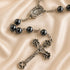 Hematite bead rosary close-up of medal connector and silver-toned crucifix