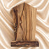 Back view of a Madonna and Child olive wood plaque showing natural grain and bark edge