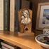 Madonna and Child olive wood plaque displayed on a shelf in a warm Christian home interior