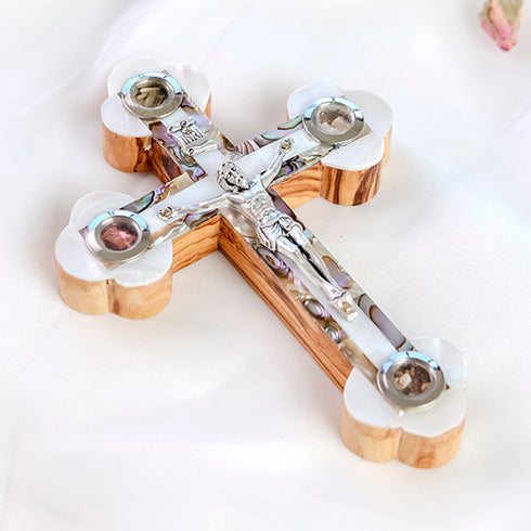 Handmade Eastern cross made of rich olive wood, detailed with white mother of pearl design, silver crucifix, and the four sacred elements from the Holy Land.