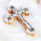 Handmade Eastern cross made of rich olive wood, detailed with white mother of pearl design, silver crucifix, and the four sacred elements from the Holy Land.