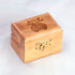 Image of an olive wood box with Piece of Holy Land logo engraved, placed on a white background.