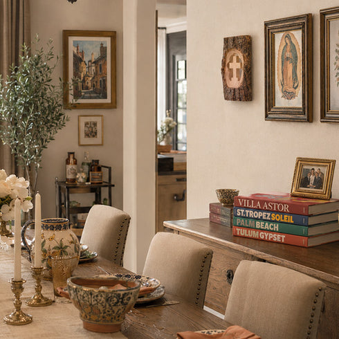 Dining room with a wooden table, chairs, and decorative items on the wall.