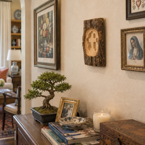 Nestled corner of a room with a bonsai tree, books, and decorative items on a table.